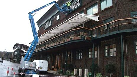 Workmen on a high-rise cherry picker at Wimbledon