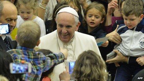 Pope Francis (C) greets the crowd during his weekly general audience at Paul VI audience hall on February 4, 2015 at the Vatican