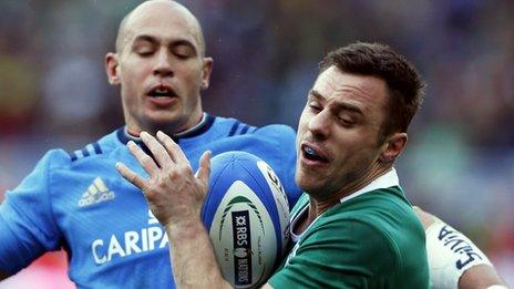 Italy captain Sergio Parisse in action against Tommy Bowe of Ireland