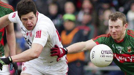 Sean Cavanagh of Tyrone in action against Mayo's Colm BHoyle