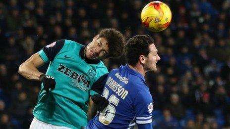 Rudy Gestede and Sean Morrisson compete in the air
