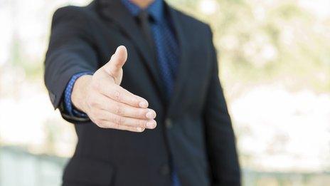 Businessman offering a handshake