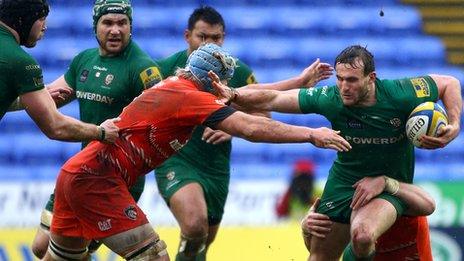 Andrew Fenby (r) takes on the Leicester defence