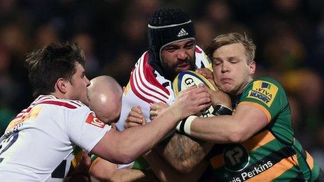 Northampton and Harlequins players battle for the ball