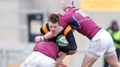 Coleraine pair David Greatorex and Callum Smith tackle Callum McLaughlin