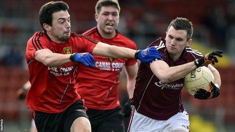 Down's Damien Turley tackles Galway forward Michael Martin