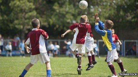 Youngsters playing football