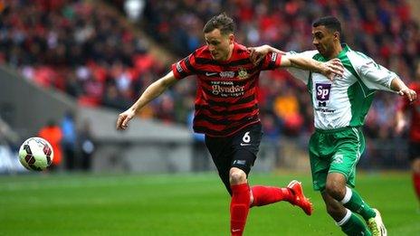 Joe Clarke (L) of Wrexham looks to hold off Jason St Juste of North Ferriby during the The FA Carlsberg Trophy Final match between North Ferriby United and Wrexham at Wembley Stadium