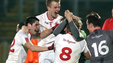 Tyrone players celebrate at the final whistle