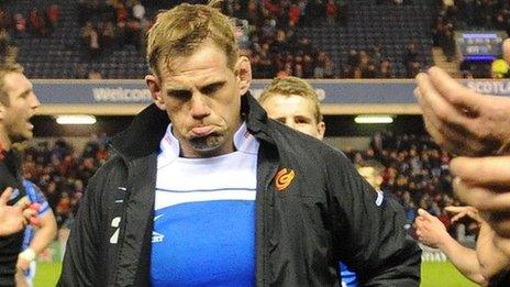 Rhys Thomas is dejected as he leaves the pitch at Murrayfield