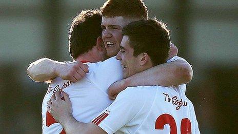 Tyrone players celebrate at the final whistle in Tullamore