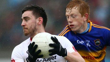 Padraig Hampsey of Tyrone in possession against Tipperary's Josh Keane