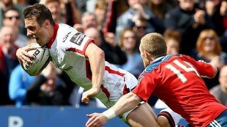 Tommy Bowe dives over the Munster line for the opening try