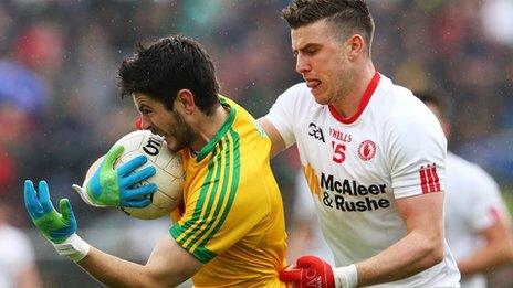 Donegal's Ryan McHugh is tackled by Conor McAliskey