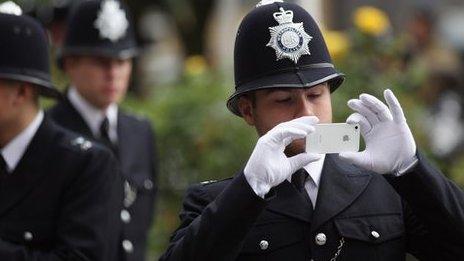 Police officer using camera phone