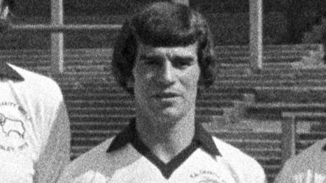 Henry Newton is pictured in a photo with other players from the Derby title winning squad. 