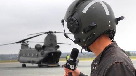 Newsbeat reporter Dan Whitworth in front of a Chinook