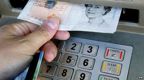 £10 note being taken out of cash machine