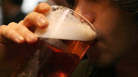 Man drinking pint