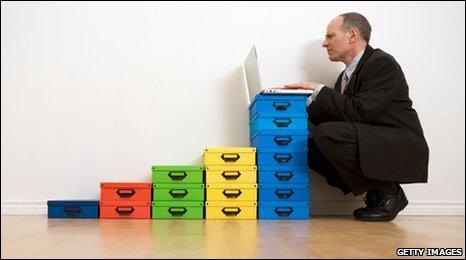 Man with boxes and laptop