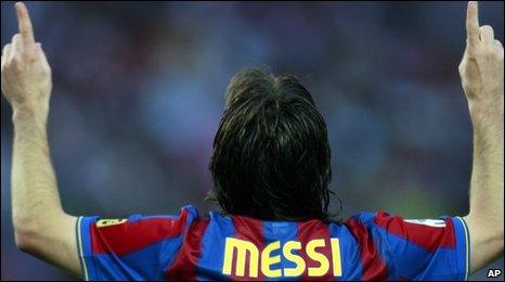 Lionel Messi celebrates after scoring against Valladolid during a Spanish La Liga soccer match at the Camp Nou stadium in Barcelona on 16 May