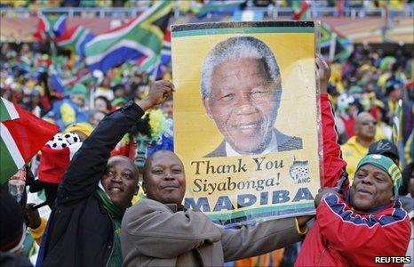 South African fans carry Nelson Mandela poster