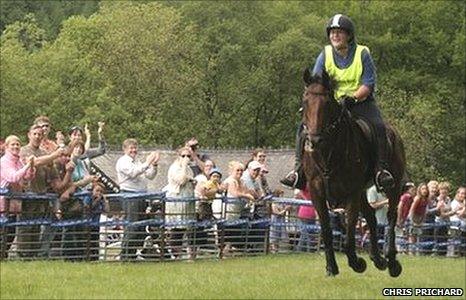 Llinos Mair Jones crosses the finishing line in triumph on Sly Dai in the 2010 Man v Horse race