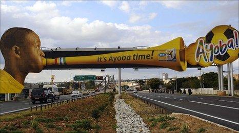 Advertising billboard showing a man blowing a vuvuzela, in Polokwane, South Africa, on 31/5/2010