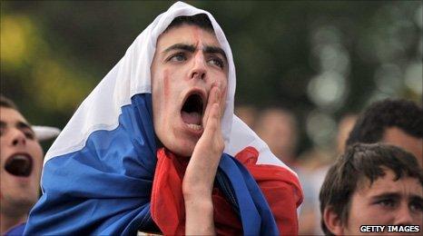 A French fan watches them play in the fan zone in Paris