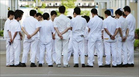 Workers at a strike-hit Honda Lock plant in Zhongshan, Guangdong province, on 18 June 2010