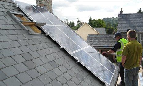 Solar panels being fitted to a home