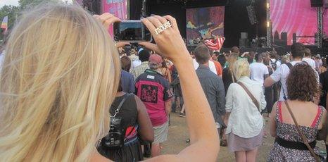 Music fan holding mobile phone