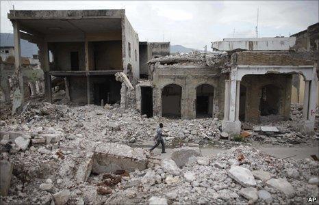 Man walks through rubble in Port au Prince