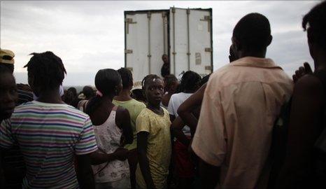 People wait in line for tents at the Canahan 2 camp for earthquake displaced people on the outskirts of Port-au-Prince, Haiti, June 30, 2010,