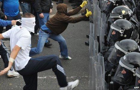 Riot police and protesters