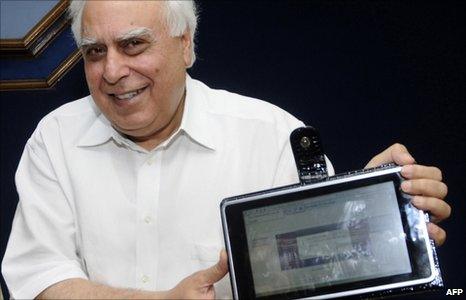 Indian Minister for Human Resource Development Kapil Sibal unveils the "laptop" device in Delhi on 22 July 2010