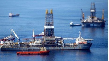 Ships work near the site of the BP Deepwater Horizon oil spill