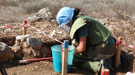 A UN peacekeepers clears mines along the Israeli-Lebanese frontier