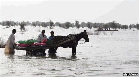 A family trying to rescue their belongings