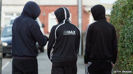 Teenagers wearing hoods