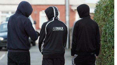 Teenagers wearing hoods