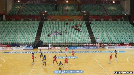 A handful of spectators watch a netball match between England and Barbados at the Thyagaraj Sports Complex during day one of the Delhi 2010 Commonwealth Games on 4 October 2010