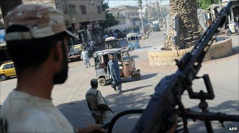 Pakistani soldier keep watch on a street in Karachi on October 21 2010