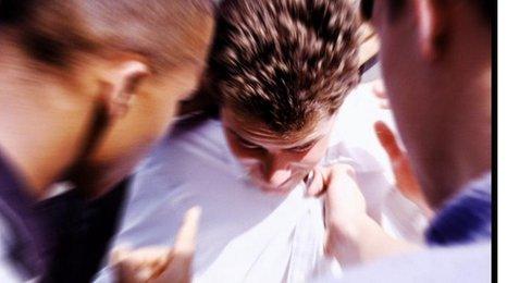 Boy being bullied - posed photo