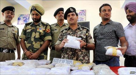 Indian police near Amritsar show 31kg of seized heroin