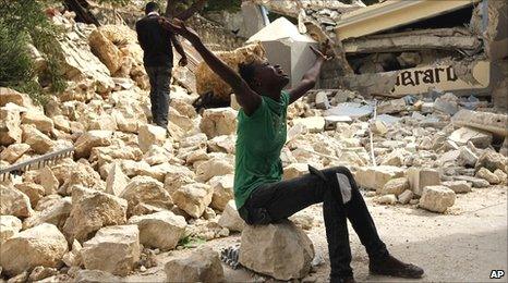 A girl screams amid the rubble of the Haiti earthquake in Port-au-Prince, 14 January, 2010