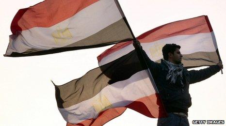 Man with Egyptian flag in Tahrir Square