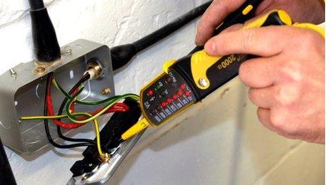 Electrician testing a socket