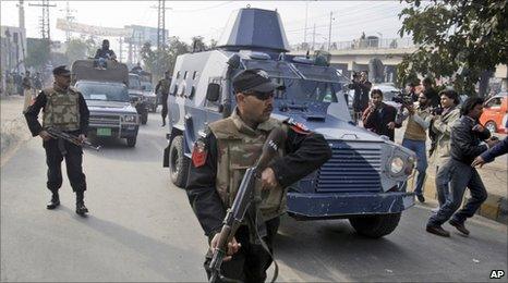 An armoured car carrying Raymond Davis leaves a court in Lahore on 11 February 2011