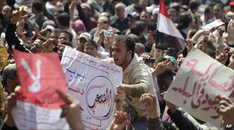 Egyptians shout slogans during a protest against the changes in Tahrir Square in Cairo, on 18 March.